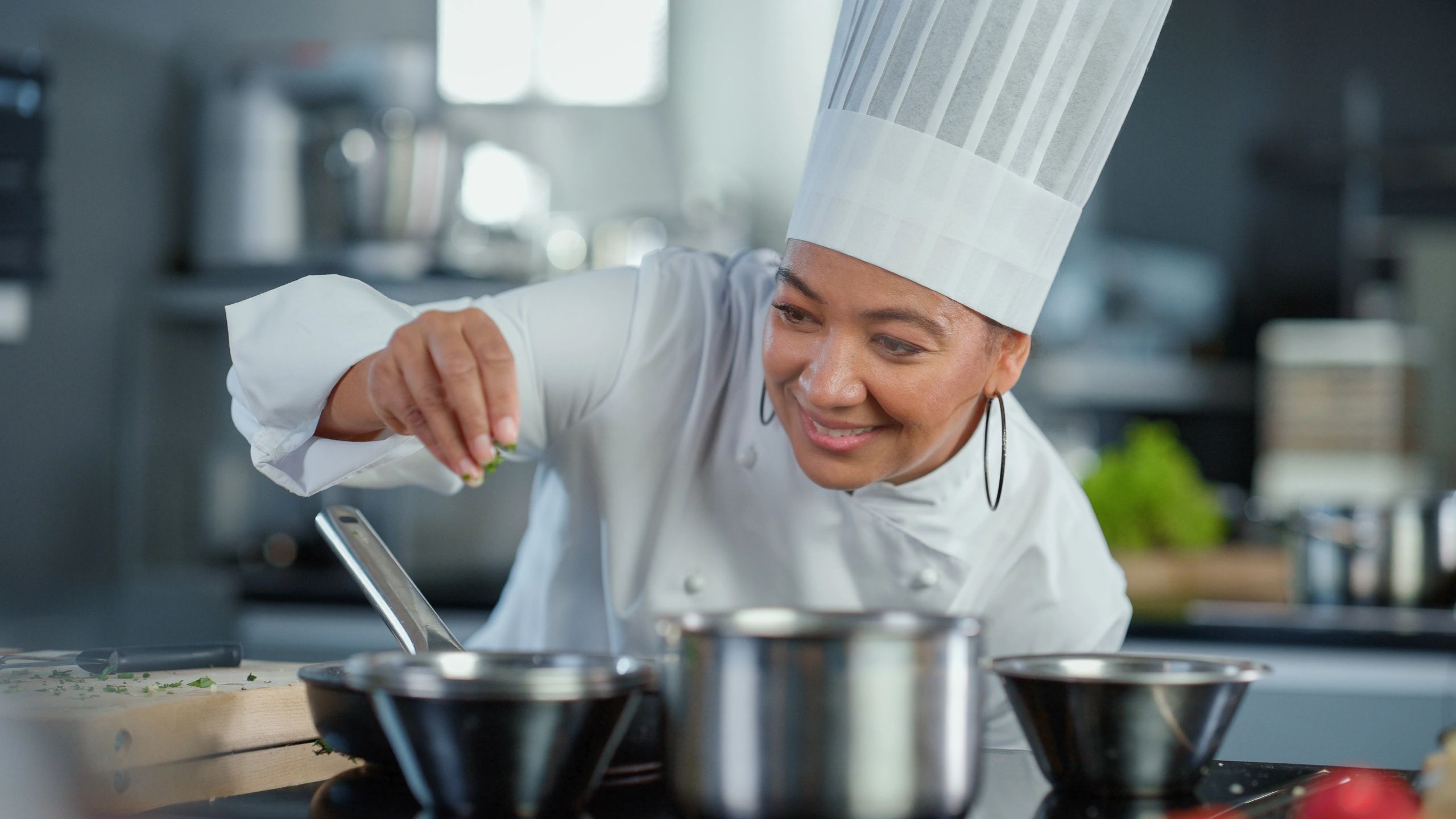 Chef preparing a dish in a restaurant kitchen