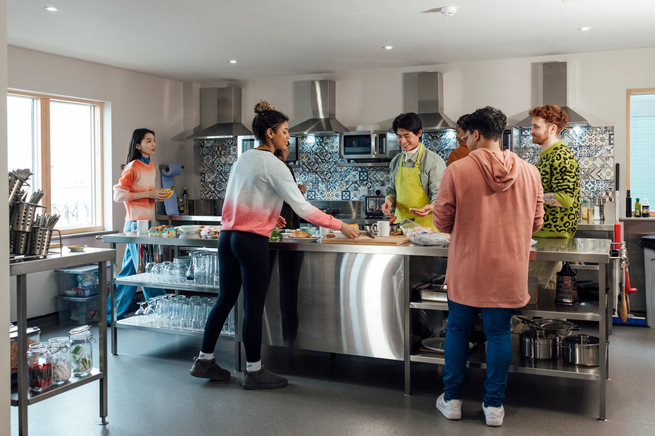 Café team gathering in a communal kitchen