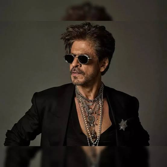 Portrait of Shah Rukh Khan wearing sunglasses and a black blazer